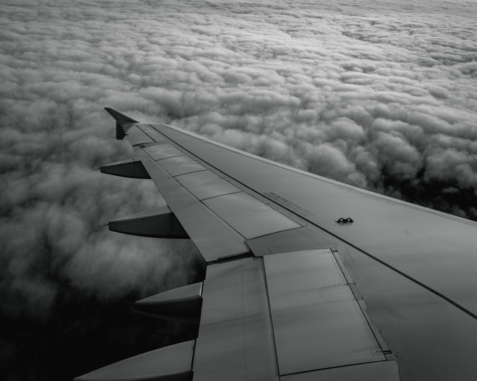 Airplane wing flying through thick clouds under instrument flight rules