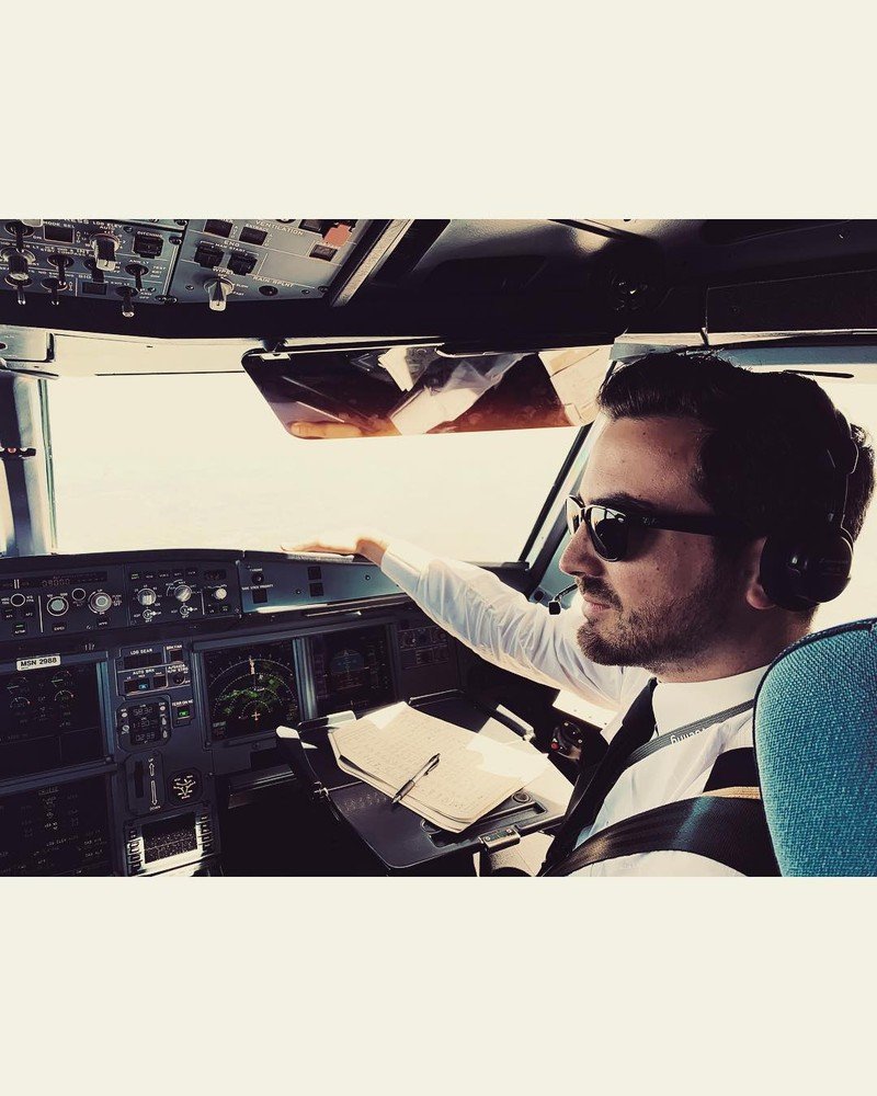Pelican Flight School graduate navigating an airplane cockpit.